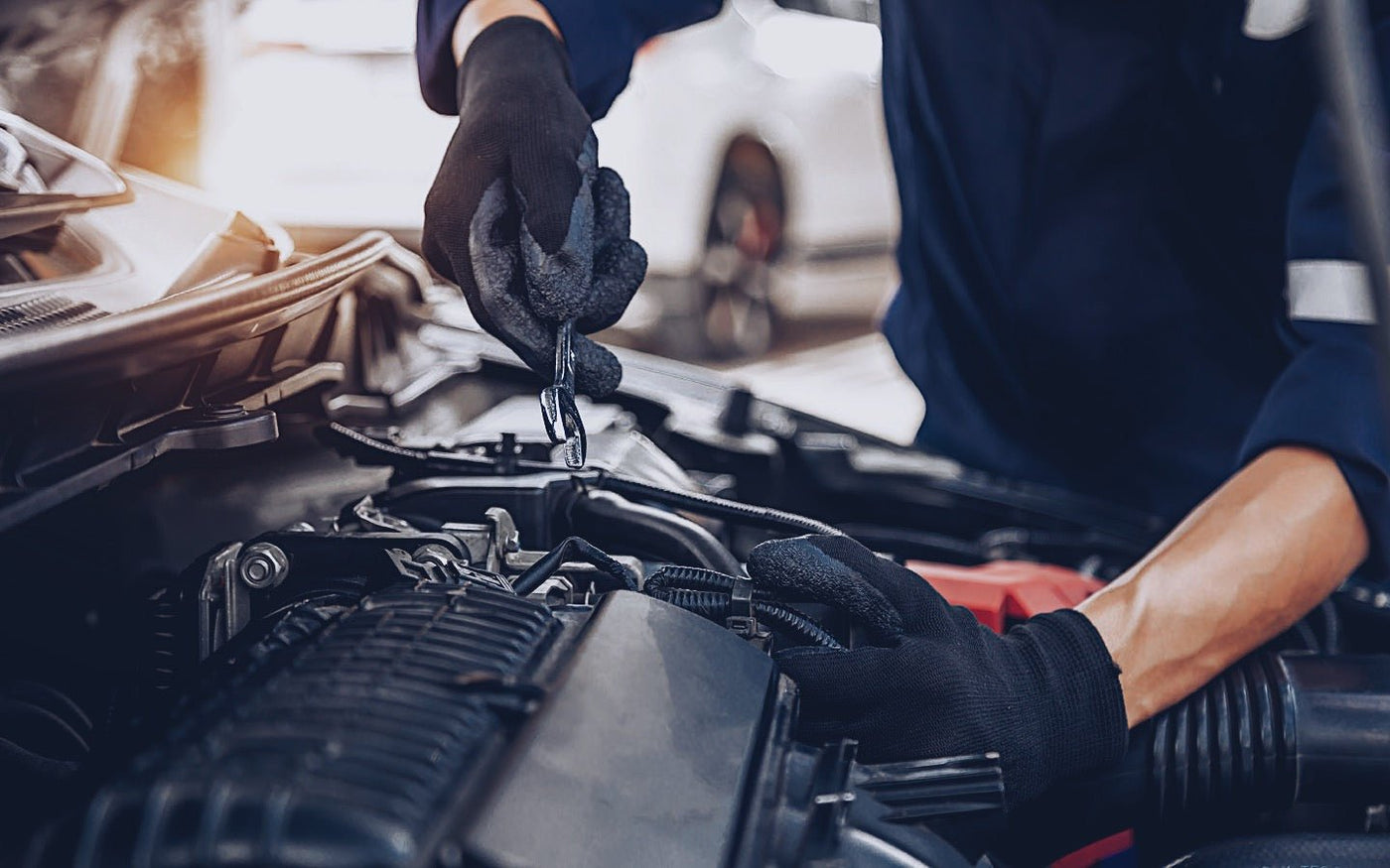 Mechanic working on a jdm engine.
